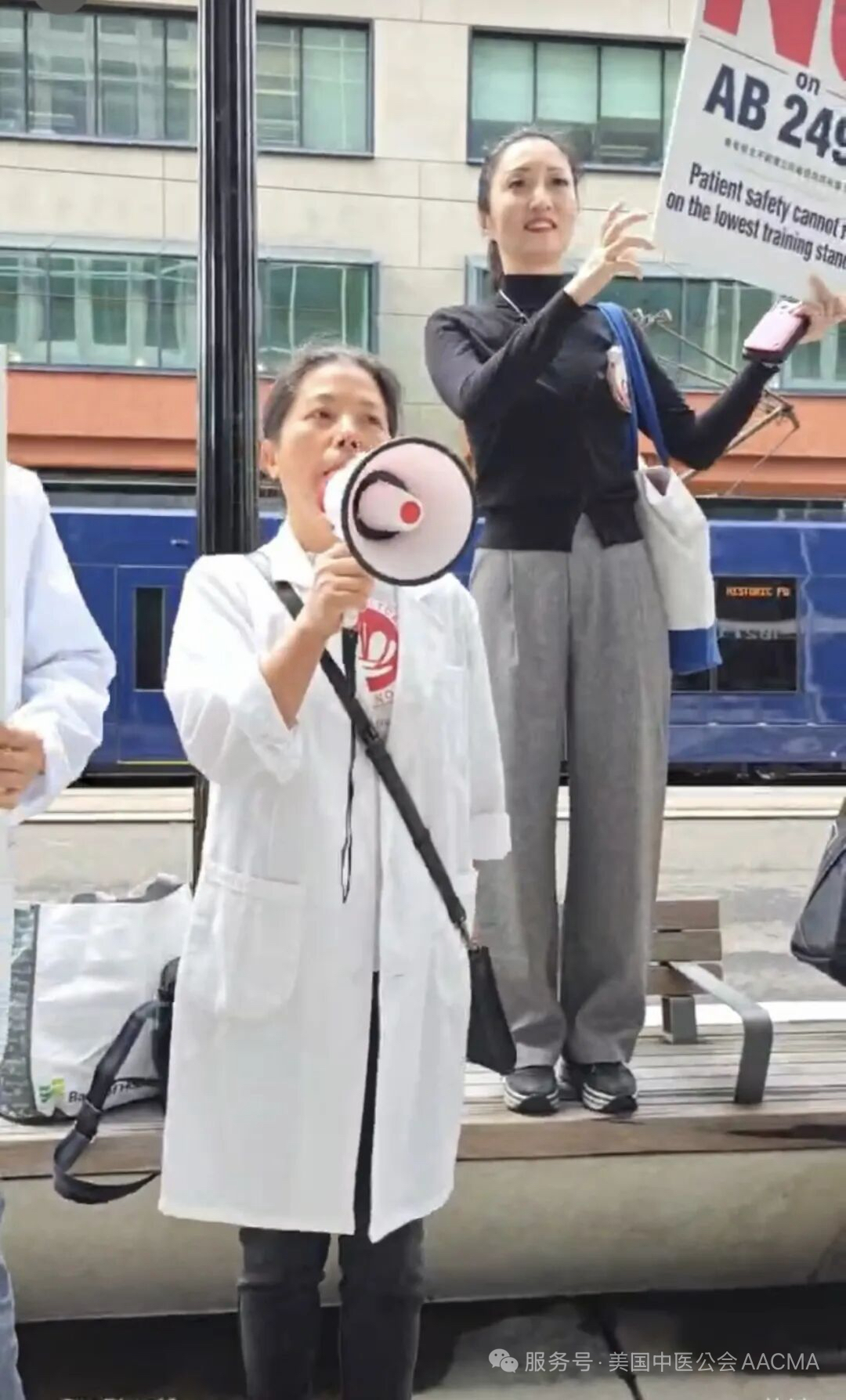 Practitioner rallying with megaphone outside the Capitol